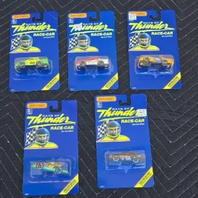 Five vintage Matchbox Days of Thunder die-cast race cars, new in their original 1990 blister packaging.