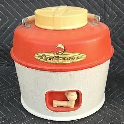 Vintage Fun-Tex insulated water jug featuring a red and white textured body, yellow lid, and built-in spigot, circa 1950s or 1960s.