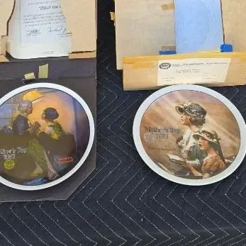 Two Norman Rockwell Mother's Day collector plates from 1977 and 1979, complete with their original boxes and documentation.