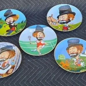 Set of five vintage Red Skelton collector plates, each featuring a different whimsical illustration of his famous hobo character, Freddy...