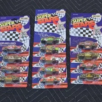 Three Matchbox Racing Super Stars die-cast car sets in original blister packaging, featuring various NASCAR stock cars from the early 1990s.