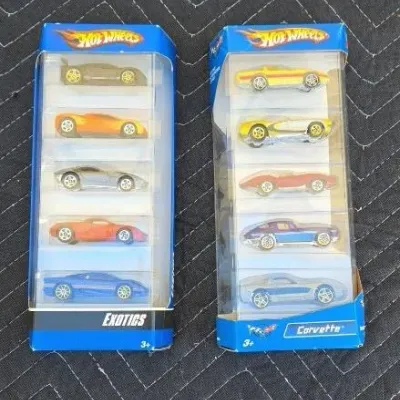 Two Hot Wheels 5-packs in original packaging, featuring the "Exotics" and "Corvette" collections.