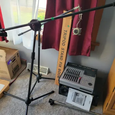 3 boom microphone stands and Fostex sound mixing board and speakers