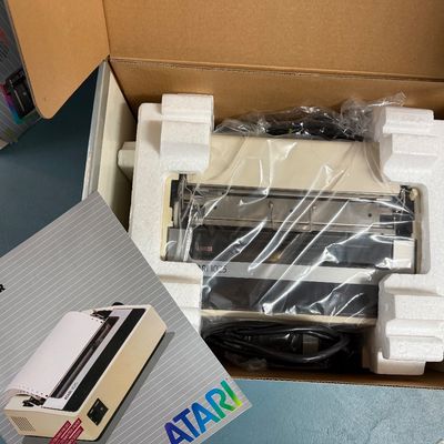 Sale Photo Thumbnail #8: Vintage Atari 1025 printer, complete in box with original styrofoam packaging, plastic wrap, power cord, and owner's guide.