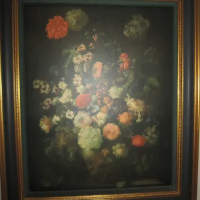 Framed floral still life print in the Dutch Golden Age style, housed in a dark wood frame with gold-painted inner and outer borders.
