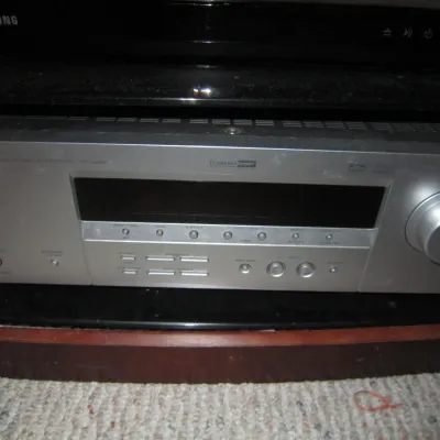 Yamaha HTR-5930 Natural Sound AV receiver in a silver finish, showing some light dust from storage.