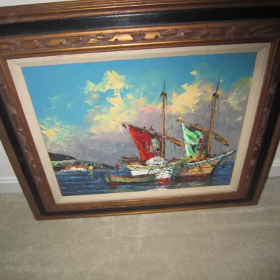 Mid-century impressionist oil painting depicting sailboats in a harbor, housed in an ornate wooden frame with a linen liner.