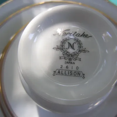 Noritake "Allison" pattern (number 2610) fine china teacup and saucer, showing the maker's mark on the underside of the cup.