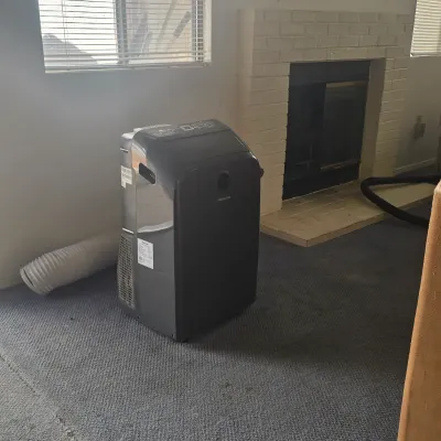 Hisense portable air conditioner in dark gray, complete with exhaust hose, available for a buy-it-now price of $150.