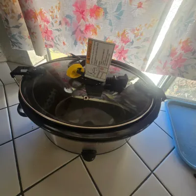 Stainless steel slow cooker with a locking glass lid, in excellent condition, available for a Buy It Now price of $20.