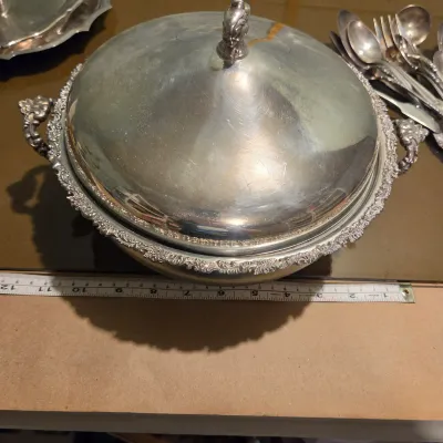 Sale Photo Thumbnail #80: Handful of interesting silver plate / stainless, the casserole is particularly pretty with a secondary removable band, couple smallish platters and some napkin rings