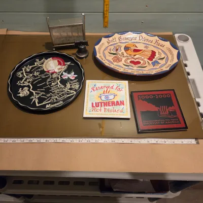 Sale Photo Thumbnail #57: Couple trivets, metal Minnesota tray, PA platter (so cute), coin sorter, liberty bell