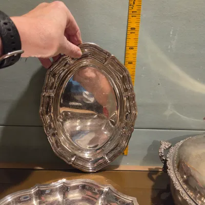 Sale Photo Thumbnail #68: Handful of interesting silver plate / stainless, the casserole is particularly pretty with a secondary removable band, couple smallish platters and some napkin rings