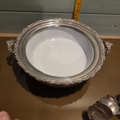 Sale Photo Thumbnail #73: Handful of interesting silver plate / stainless, the casserole is particularly pretty with a secondary removable band, couple smallish platters and some napkin rings