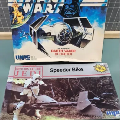 Vintage MPC Star Wars model kits in original boxes, including Darth Vader TIE Fighter and Return of the Jedi Speeder Bike.