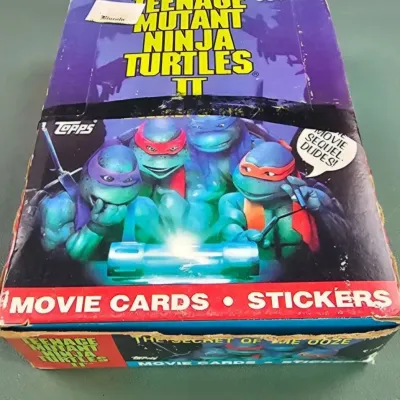 Vintage 1991 Topps Teenage Mutant Ninja Turtles II: The Secret of the Ooze movie cards and stickers display box, showing some wear and...