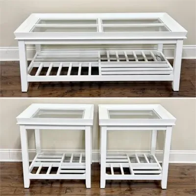 Sale Photo Thumbnail #2: Three-piece white painted living room table set, including a rectangular coffee table and two matching square end tables, all featuring glass-insert tops and slatted lower shelves.