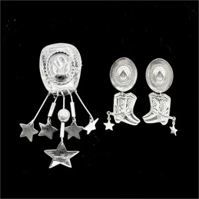Sale Photo Thumbnail #34: Sterling silver Western-themed jewelry set, featuring a cowboy hat brooch with dangling stars and matching cowboy boot and hat drop earrings.