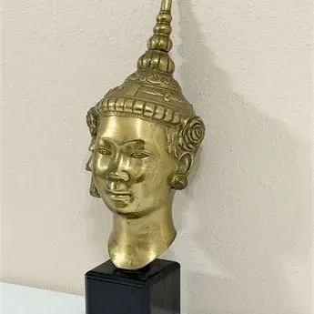 Sale Photo Thumbnail #29: Vintage brass Thai or Cambodian deity head bust with a tall, pointed headdress, mounted on a square black wooden base.