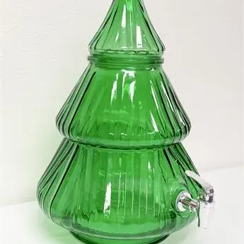 Sale Photo Thumbnail #51: Vintage green glass Christmas tree beverage dispenser with a ribbed texture, matching glass lid, and a silver-tone spigot.