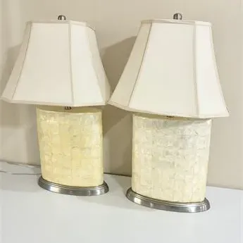 Sale Photo Thumbnail #18: Pair of contemporary table lamps featuring mother-of-pearl tiled bases on brushed metal plinths, complete with cream-colored fabric shades.