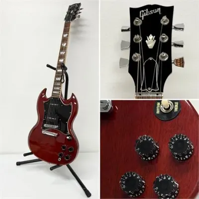 Sale Photo Thumbnail #50: Gibson SG electric guitar in a cherry red finish, displayed on a black stand with close-up views of the headstock and control knobs.
