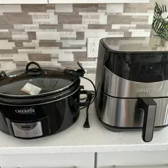 Sale Photo Thumbnail #35: Black Crock-Pot programmable slow cooker with locking lid alongside a Gourmia stainless steel and black air fryer, both in clean, gently used condition.