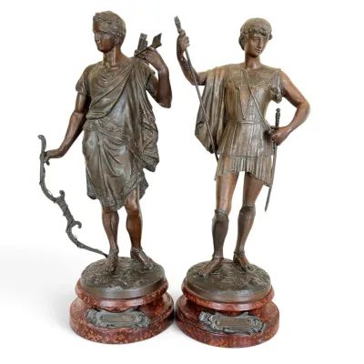 Sale Photo Thumbnail #55: Pair of French patinated bronze figures depicting classical warriors, mounted on circular red marble bases with nameplates, circa late 19th century.