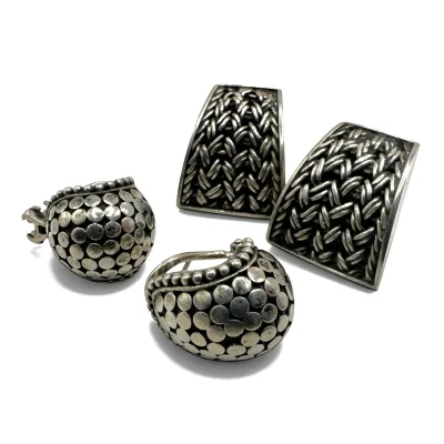 Sale Photo Thumbnail #114: Two pairs of vintage sterling silver clip-on earrings, featuring one pair with a textured basketweave design and another pair with a raised dot pattern.