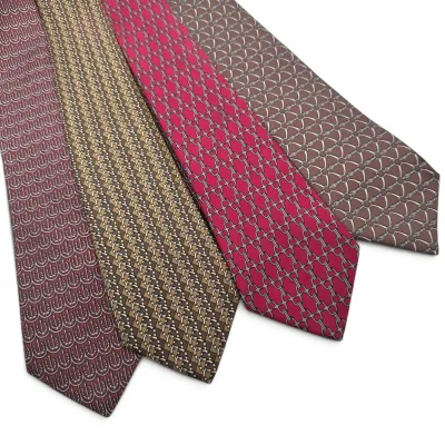 Sale Photo Thumbnail #162: Hermes Four vintage silk neckties featuring equestrian-themed patterns, including stirrups, bits, and horseshoes, in shades of burgundy, gold, pink, and brown.
