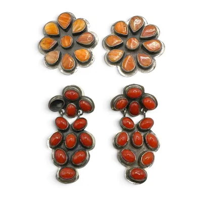 Sale Photo Thumbnail #141: Two pairs of Southwestern sterling silver earrings, featuring a floral spiny oyster shell pair and a dangling red coral cluster pair with one missing stone.