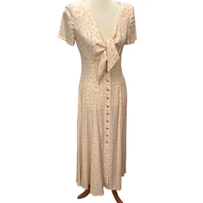 Sale Photo Thumbnail #173: Escada Vintage 1990s cream and beige patterned maxi dress featuring a tie-front bodice, short sleeves, and a button-down front skirt.