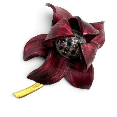 Sale Photo Thumbnail #135: Vintage enamel flower brooch featuring deep burgundy petals, a gold-tone stem, and a textured silver-tone center.