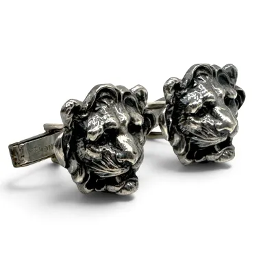 Sale Photo Thumbnail #157: Vintage sterling silver lion head cufflinks with detailed manes and toggle backs.