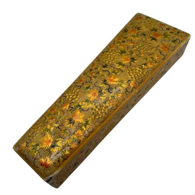 Sale Photo Thumbnail #94: Vintage Kashmiri papier-mâché pen box featuring an intricate hand-painted floral and leaf pattern in gold, yellow, and green tones.