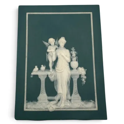 Sale Photo Thumbnail #11: Mettlach blue jasperware rectangular plaque featuring a white bas-relief classical scene of a woman, cupid, and doves.