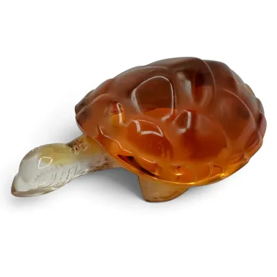 Sale Photo Thumbnail #28: Vintage amber and clear art glass turtle figurine, featuring a textured shell and smooth, stylized head.