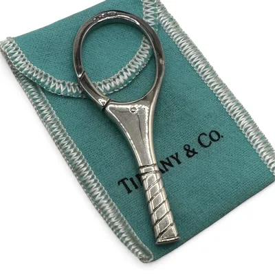 Sale Photo Thumbnail #140: Tiffany & Co. sterling silver tennis racket key ring, displayed on its signature blue dust pouch.
