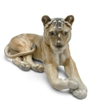 Sale Photo Thumbnail #2: Royal Copenhagen porcelain figurine of a reclining lioness, model number 804, designed by Lauritz Jensen with a glossy glaze finish.