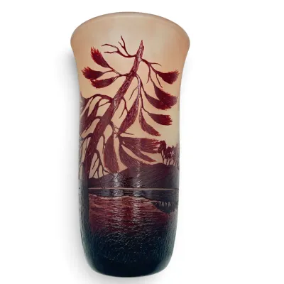 Sale Photo Thumbnail #30: Art Nouveau style cameo glass vase featuring an acid-etched landscape scene with a prominent pine tree in deep burgundy tones over a frosted amber background.