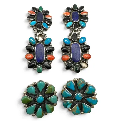 Sale Photo Thumbnail #142: Two pairs of Southwestern sterling silver earrings, including multi-stone dangle earrings with lapis, turquoise, and coral, alongside a pair of turquoise cluster stud earrings.
