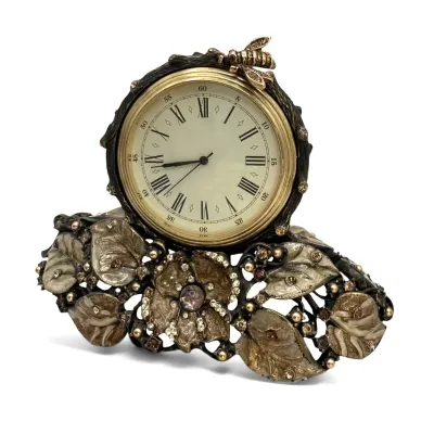 Sale Photo Thumbnail #86: Jay Strongwater ornate desk clock featuring a floral and leaf base adorned with crystals and a small bee accent on top.