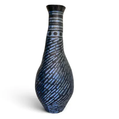 Sale Photo Thumbnail #35: Artisan ceramic vase featuring a textured blue and black geometric pattern with a slender neck and bulbous base.