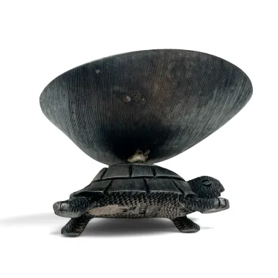 Sale Photo Thumbnail #87: Hand-carved dark wood turtle figurine supporting a shallow bowl on its shell, featuring detailed textured patterns.