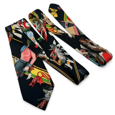 Sale Photo Thumbnail #160: Hermes Vintage silk necktie featuring a colorful Native American themed graphic print on a black background.