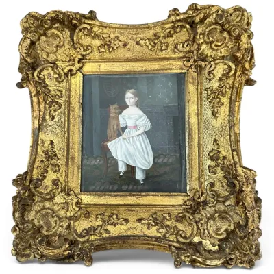 Sale Photo Thumbnail #61: Antique folk art portrait painting of a young girl in a white dress with her dog, housed in an ornate, heavily carved gilt gesso frame.