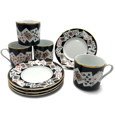 Sale Photo Thumbnail #16: Tiffany Vintage porcelain demitasse cup and saucer set featuring a playing card motif with gold-gilded rims.