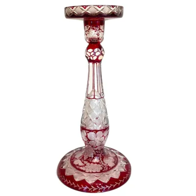 Sale Photo Thumbnail #47: Bohemian ruby red cut-to-clear crystal candlestick, featuring intricate floral and grapevine etchings with geometric cut patterns.