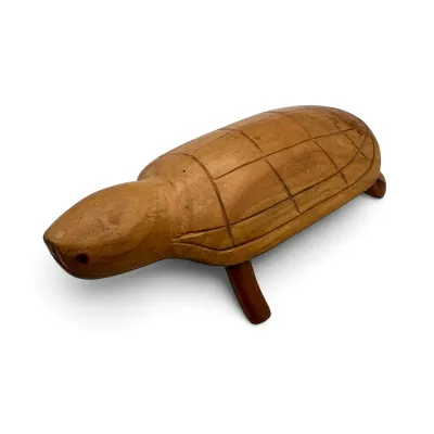 Sale Photo Thumbnail #88: Hand-carved wooden turtle figurine with a cross-hatched shell pattern and a smooth, natural finish.