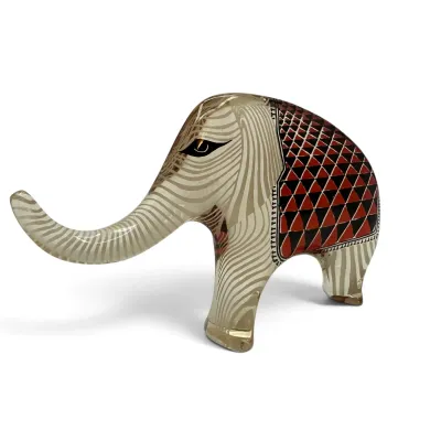 Sale Photo Thumbnail #38: Abraham Palatnik mid-century modern lucite elephant figurine, featuring an internal red, black, and white geometric pattern.